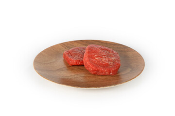 fresh ground steak on plate  isolated on white background 