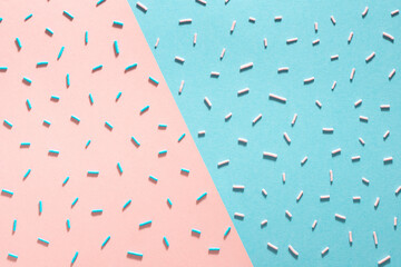 sprinkles with trendy hard shadow on blue and pink background for design banner, poster, flyer, card, postcard, cover, brochure over pink and blue, flat lay