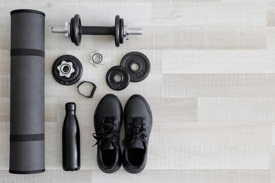 Black workout equipment for training at home or gym top view with copy space