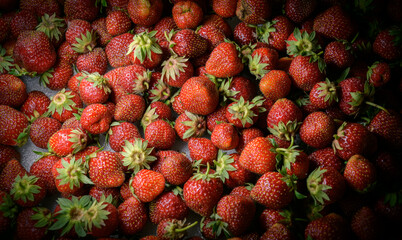 Natural looking fresh red strawberry in package.
