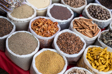 Indian assortment of mixed spices and seasonings at Goa commerce. Colorful additives, dried and powdered selling.