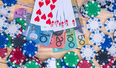 Obraz premium Card combination on australian dollars with casino chips