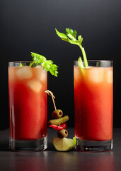 Cocktail Bloody Mary on a black background.