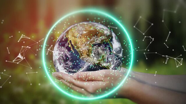 Planet Earth in hands on the background of nature. Environmental protection, ecology, technology concept.