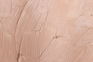 Beige cosmetic foundation cream background, texture