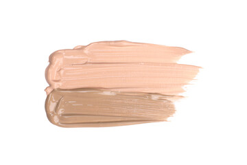 Smears of foundation cream in different shades isolated on white