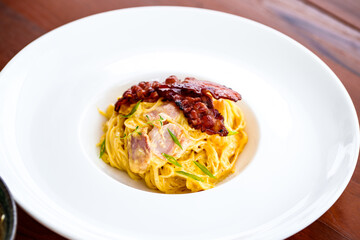 spaghetti with tomato sauce in white plate