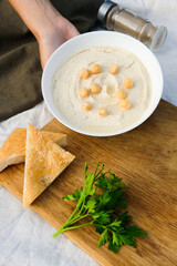 Home made hummus with vegetables, vegan healthy food for breakfast, lunch or dinner
