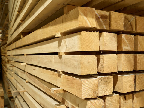 Stacked square shaped timbers in workshop