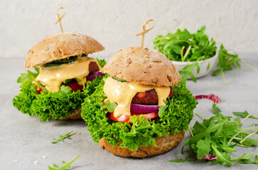 Delicious Burgers with Vegetables and Sauce, Fresh and Tasty Plant Based Meatless Burgers on Bright Background