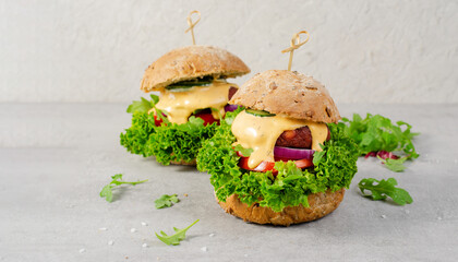 Delicious Burgers with Vegetables and Sauce, Fresh and Tasty Plant Based Meatless Burgers on Bright Background