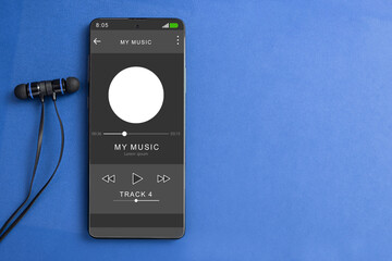 Wired headphones and a phone on the table