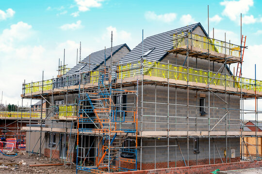 Scaffolding erected around houses in a new housing development
