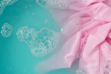 Clothes soak in powder detergent water dissolution, washing colored clothes