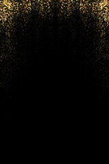 Fototapeta na wymiar Abstract background. Gold dust. Glitters on a black background. Flying particles of golden confetti.