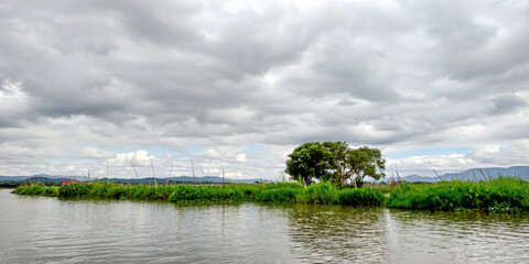 Inle Lake is a breathtaking lake in Myanmar, surrounded by mountains and lush green hills. It is home to floating villages, unique leg rowing fishermen, and stunning scenery.