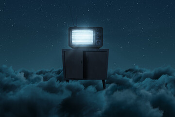 3D rendering of an old television with bright static screen above night clouds