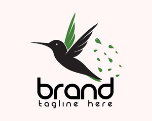 Fototapeta premium flying hummingbird with flying leaf eco nature logo symbol icon design template illustration inspiration