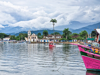 Port of Paraty, Brazil with colorful tourist and fishing boats in the bay between Rio de Janeiro and Sao Paulo.