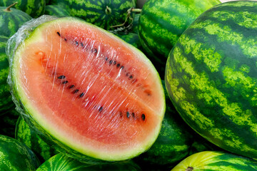 Ripe watermelon on counter in grocery department in supermarket for sale. - 616941438