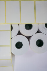 Rolls of white labels isolated. Labels for direct thermal or thermal transfer printing. Blank...