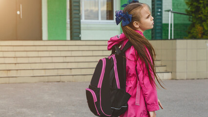 first day of school. student girl primary school is upset and does not want to go to class. The first day of autumn. concept back to school.