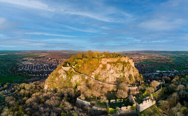 Fototapeta na wymiar Panorama of a hill with the ruins of the Hohentwil castle on its top against a blue sky