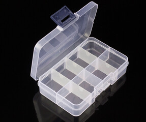 clear box for pills isolated on black background, box for tablets, box for vitamins