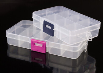clear boxes for pills isolated on black background, box for tablets, box for vitamins