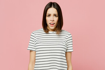 Fototapeta premium Young sad disappointed displeased dissatisfied upset caucasian woman she wear casual clothes t-shirt looking camera isolated on plain pastel light pink background studio portrait. Lifestyle concept