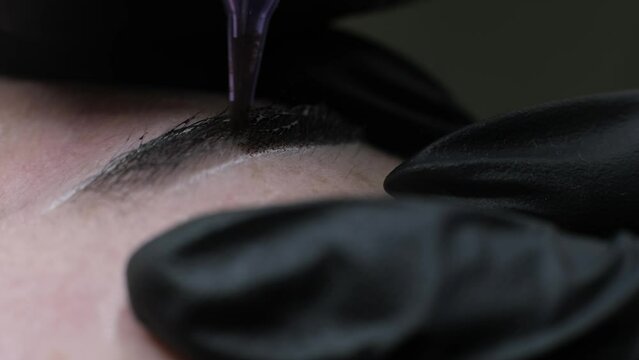 close-up video reveals the precision of the microblading needle, delicately crafting each hair stroke. Witness the transformation of sparse brows into fuller. microblading or eyebrow tattooing