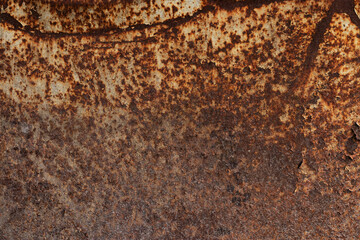 Brown, black and yellow rust on white enamel. Rusted brown and white abstract texture.