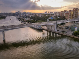 Fototapeta na wymiar The aerial view of the bridge across the river Don during the sunset at the city of Rostov-on-Don (Rostov-na-Donu), Russia, close to the border with Ukraine. 