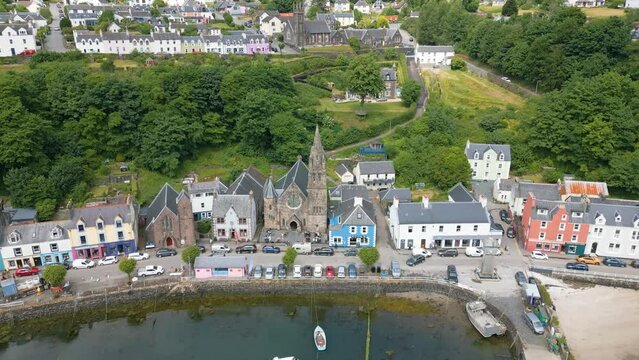 An aerial drone video of Tobermory on the Isle of Mull in Scotland. A small town with colourful houses. 