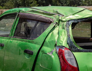 Rollover horrific traffic accident severely damaged the car.