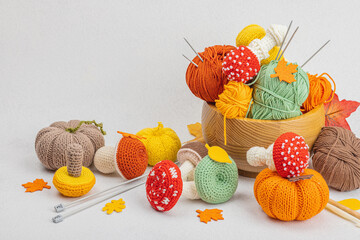 Set of clew of thread for knitting. Crocheted mushrooms, pumpkins, handmade, autumn hobby concept