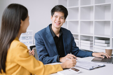 Businessmen team or financial data analysts working with tablets and laptop computers and data graphs together. Plan to analyzing projects in the office.
