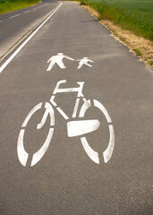 Fototapeta na wymiar Footpath and bicycle lane sign on the sidewalk