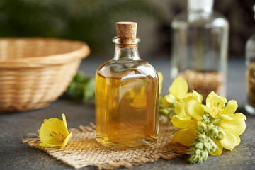 A bottle of herbal tincture with fresh mullein flowers