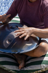 Man playing a percussion instrument. Musical instrument.