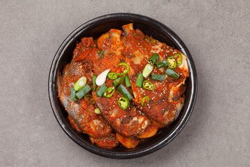 A side dish made by boiling dried fish with seasonings such as soy sauce.