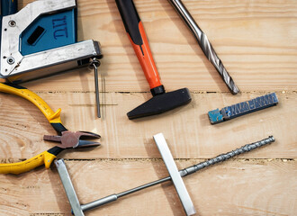 A set off a lot of different red tools for working include hammer