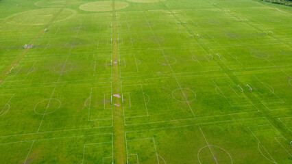 A lot of  empty football pitches or soccer pitches seen from the sky with a drone view in Hackney Marshes