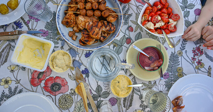 Overlooking table with grilled meat and sauces