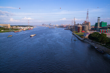 Naklejka premium Aerial view of the river and industrial area with blue sky in Narayanganj-Bangladesh