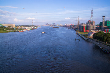 Obraz premium Aerial view of the river and industrial area with blue sky in Narayanganj-Bangladesh