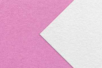 Fototapeta na wymiar Texture of lilac paper background, half two colors with white arrow, macro. Structure of dense craft pink cardboard.