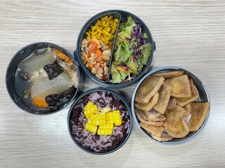 Stir pork curry and tomato fried with fried tofu and soup and corn mixed two tone brown rice