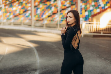 portrait of a beautiful sportswoman on a running track