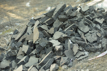 Broken asphalt. Preparation of work. Pieces of asphalt.